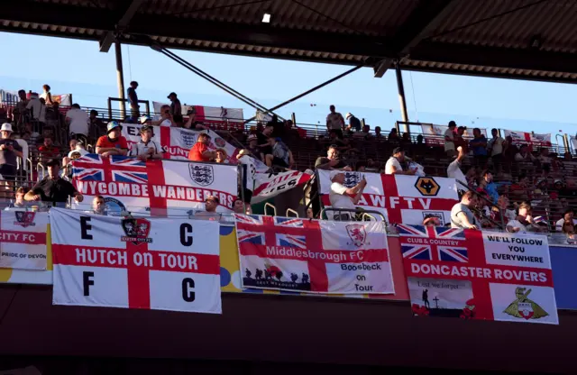 England fans put flags up in the stadium