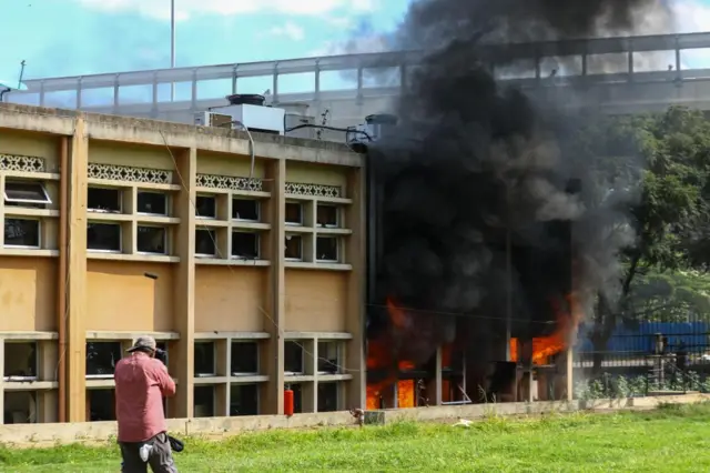 Flames and smoke engulf part of the Parliament building