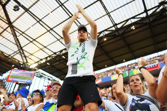 Slovenia fan leads the chants