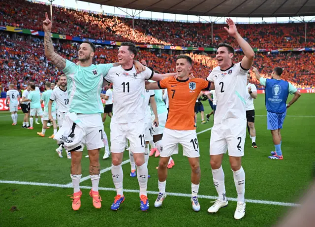 Austria's Marko Arnautovic, Michael Gregoritsch, Christoph Baumgartner and Maximilian Wober celebrate