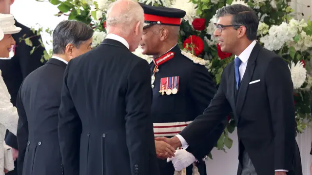 Rishi Sunak shakes hands with Emperor Naruhito of Japan