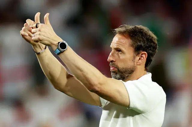 Gareth Southgate, Head Coach of England, gestures a thumbs up to fans