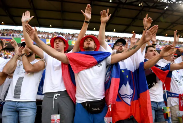 Slovenia fans chant and sing