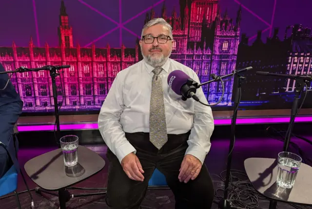 Liberal Democrat Ron Beadle sat in the studio with a microphone in front of him