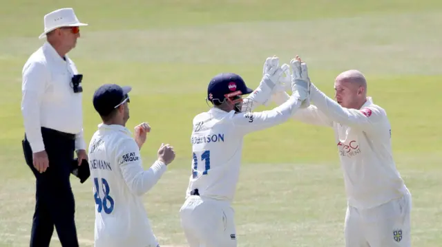 Callum Parkinson takes a wicket