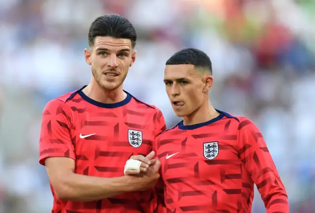 Foden and Rice shake hands in the warm up