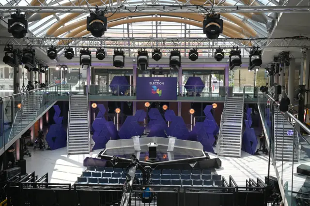 A wide shot of the debate floor