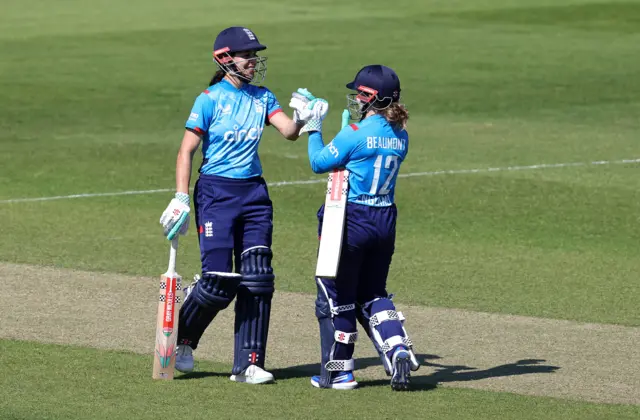 Tammy Beaumont and Maia Bouchier punch gloves