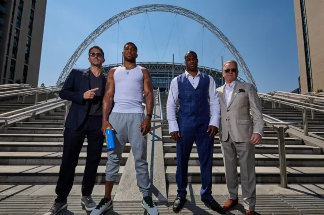 Eddie Hearn, Anthony Joshua, Daniel Dubois, Frank Warren all pose for pictures in front of Wembley arch