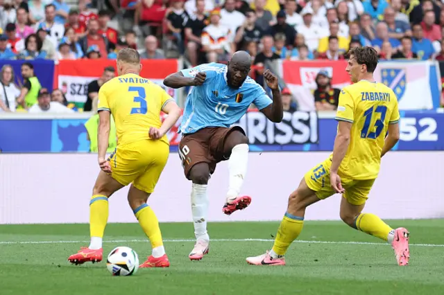 Romelu Lukaku of Belgium shoots whilst under pressure