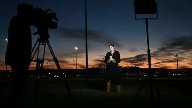 A media crew outside the airport in Canberra earlier