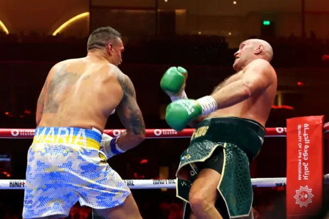 Oleksandr Usyk punches Tyson Fury in their fight