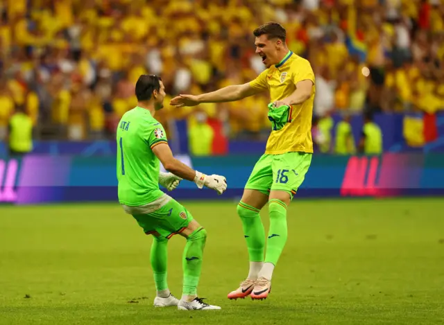 Romania players celebrate