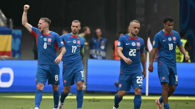 Slovakia players celebrate a goal against Romania during a Euro 2024 Group E match