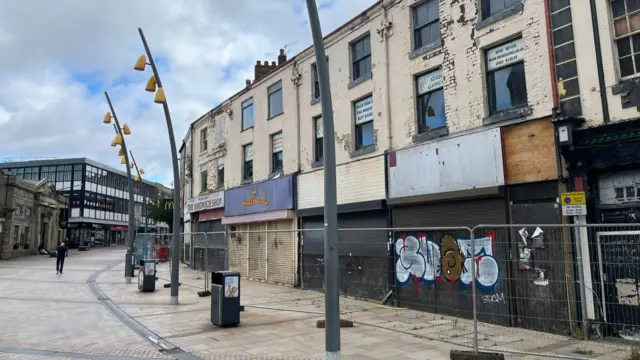 High Street with boarded-up shops