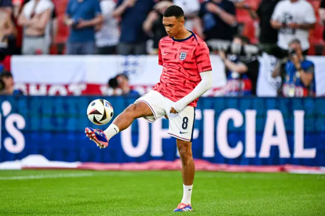 Trent Alexander-Arnold kicks a football