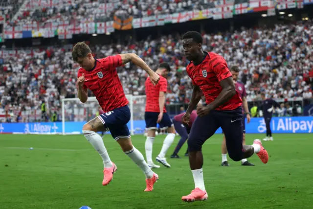 John Stones and Marc Guehi running