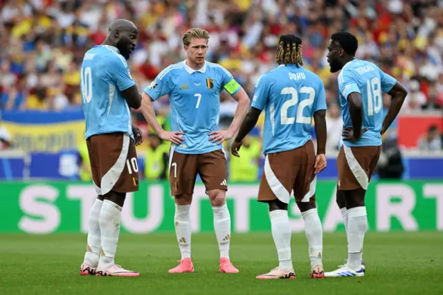 Belgium players stand in a circle