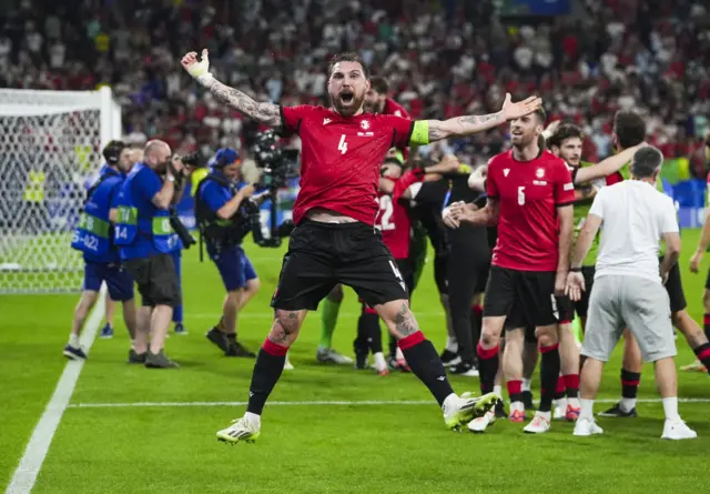 Guram Kashia jumps in the air to celebrate