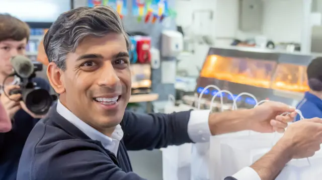 Prime Minister Rishi Sunak buys traditional fish and chips for the media at the Sea Breeze fish and chips shop in Redcar, while on the General Election campaign trail.