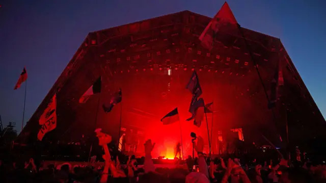 Dua Lipa performing on stage during the Glastonbury Festival