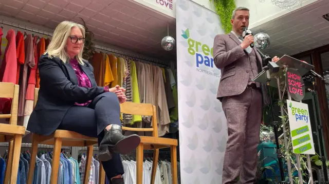 Green Party Northern Ireland leader Mal O'Hara (right) addresses the General Election manifesto launch while deputy leader Lesley Veronica looks on at the Show Some Love Greenhouse centre in Belfast