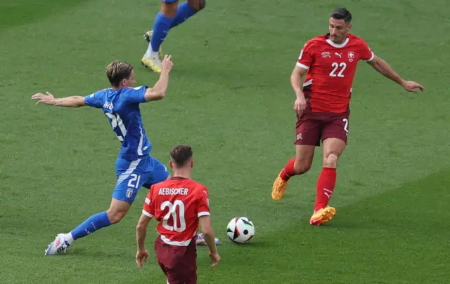 Nicolo Fagiolo of Italy (L) and Fabian Schaer of Switzerland in action