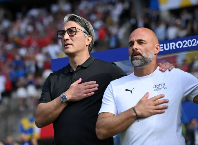 Switzerland coach Murat Yakin during the national anthems before the match