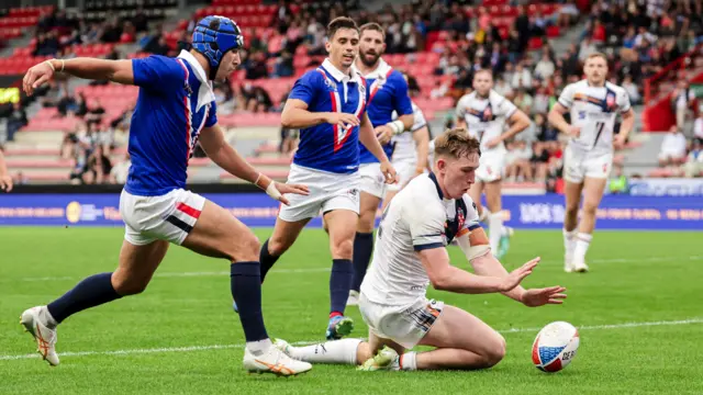 Matty Nicholson dives over to score