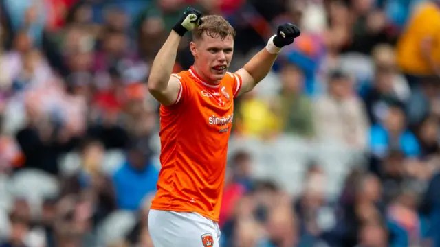 Oisín O'Neill celebrates at the full-time whistle