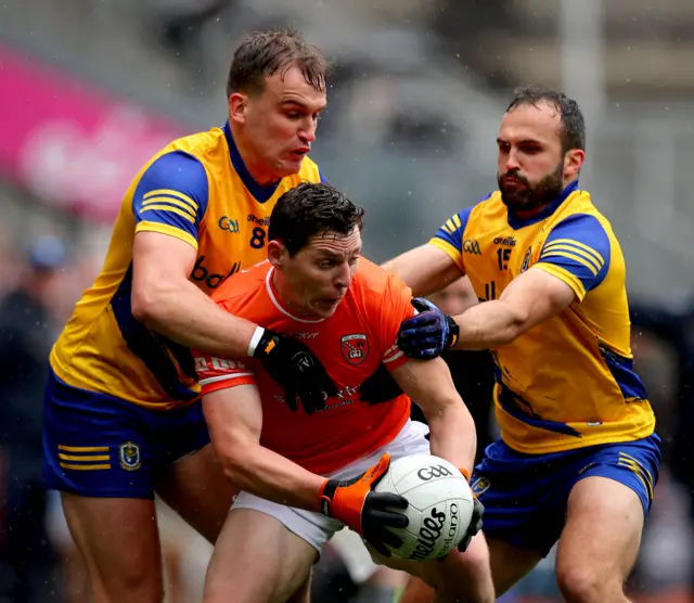 Armagh's Paddy Burns with Enda Smith and Donie Smith