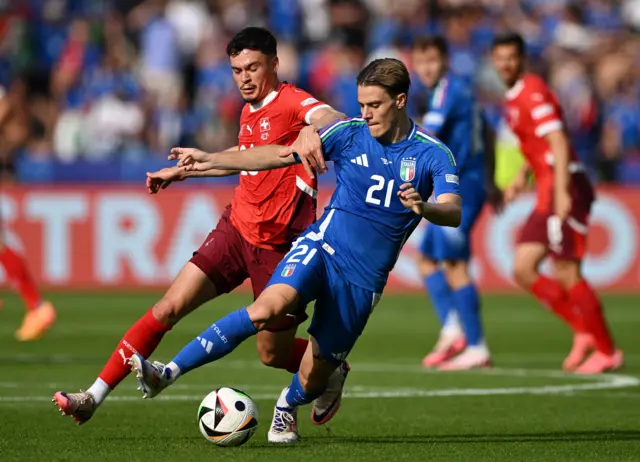 Italy's Nicolo Fagioli in action with Switzerland's Fabian Rieder