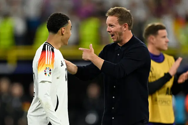 Julian Nagelsmann and midfielder #10 Jamal Musiala celebrate