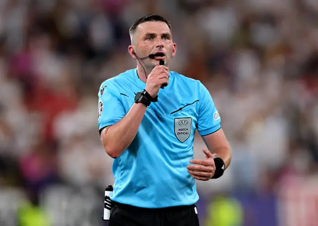 Referee Michael Oliver gestures