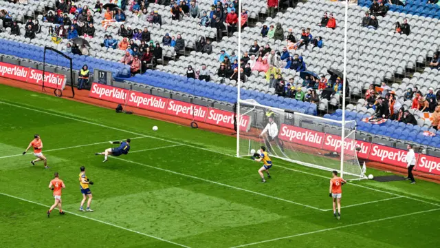 Barry McCambridge of Armagh shoots past Roscommon goalkeeper Conor Carroll