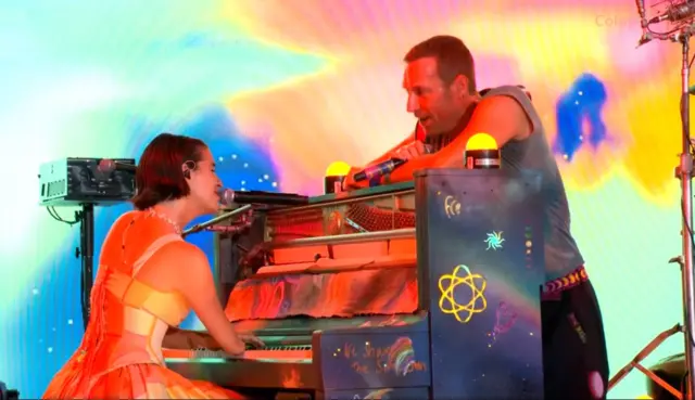 Victoria Canal performing at Glastonbury with Coldplay