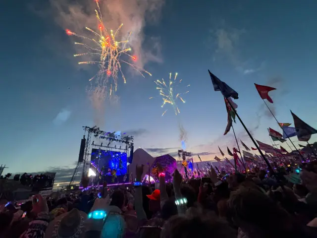 Fireworks are seen while Coldplay plays