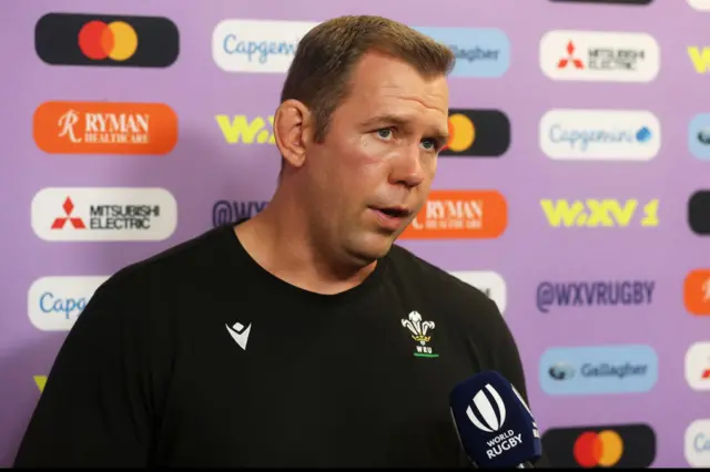 Wales head coach Ioan Cunningham speaks to the media