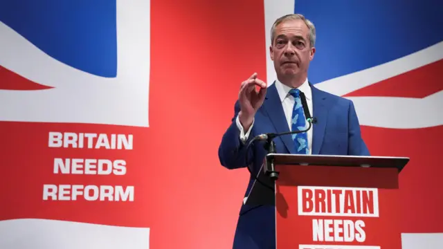 Nigel Farage gestures during a press conference