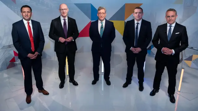 (Left to right) Scottish Labour Leader Anas Sarwar, Scottish National Party Leader John Swinney, STV’s Political Editor Colin Mackay, Scottish Conservative Leader Douglas Ross and Scottish Liberal Democrat Leader Alex Cole-Hamilton