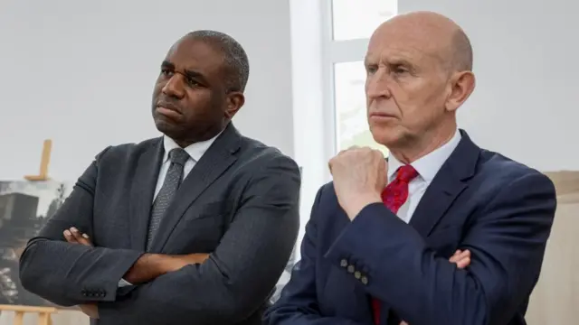 Britain's Shadow Foreign Secretary David Lammy and Shadow Defence Secretary John Healey visit a photo exhibition in the St. Andrews Church, at a site of a mass grave, in the town of Bucha, amid Russia's attack on Ukraine, outside of Kyiv, Ukraine May 13, 2024