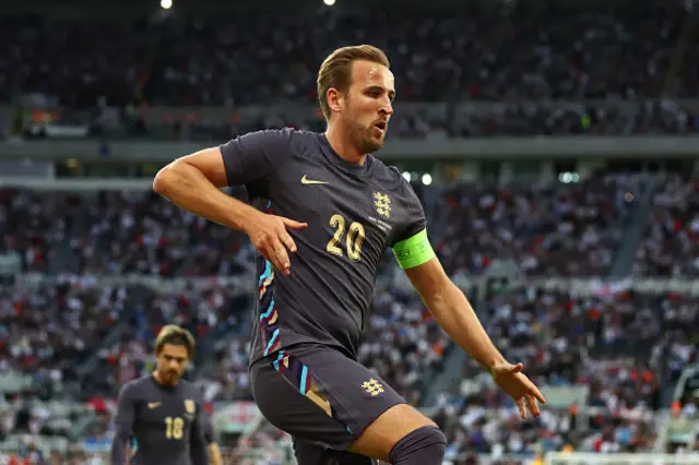 Harry Kane of England celebrates scoring the third goal