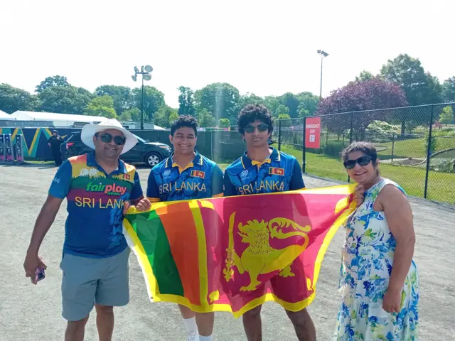 Jaywatilake family holding up the Sri Lanka flag