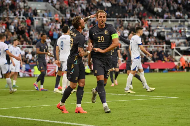 Harry Kane of England celebrates scoring his team's third goal with teammate James Maddison