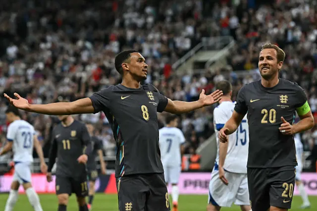 Trent Alexander-Arnold (L) celebrates scoring