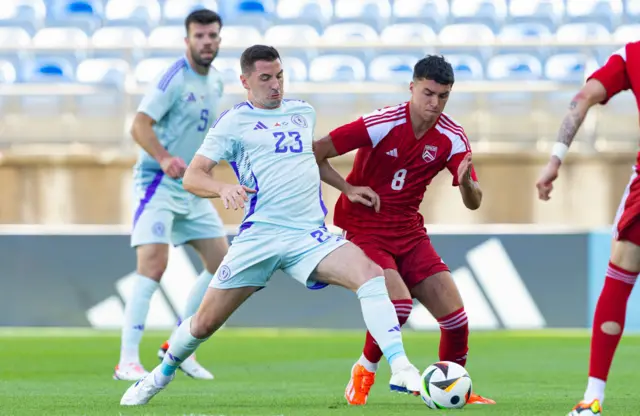 Kenny McLean wins the ball