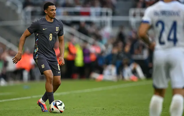 Trent Alexander-Arnold controls the ball