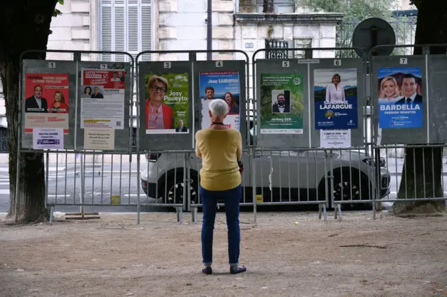 Voter looks at signs of who is running in the election