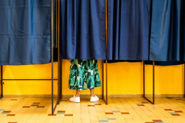 Woman seen casting ballot