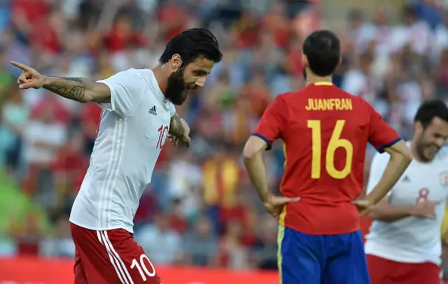 Tornike Okriashvili (R) celebrates after scoring